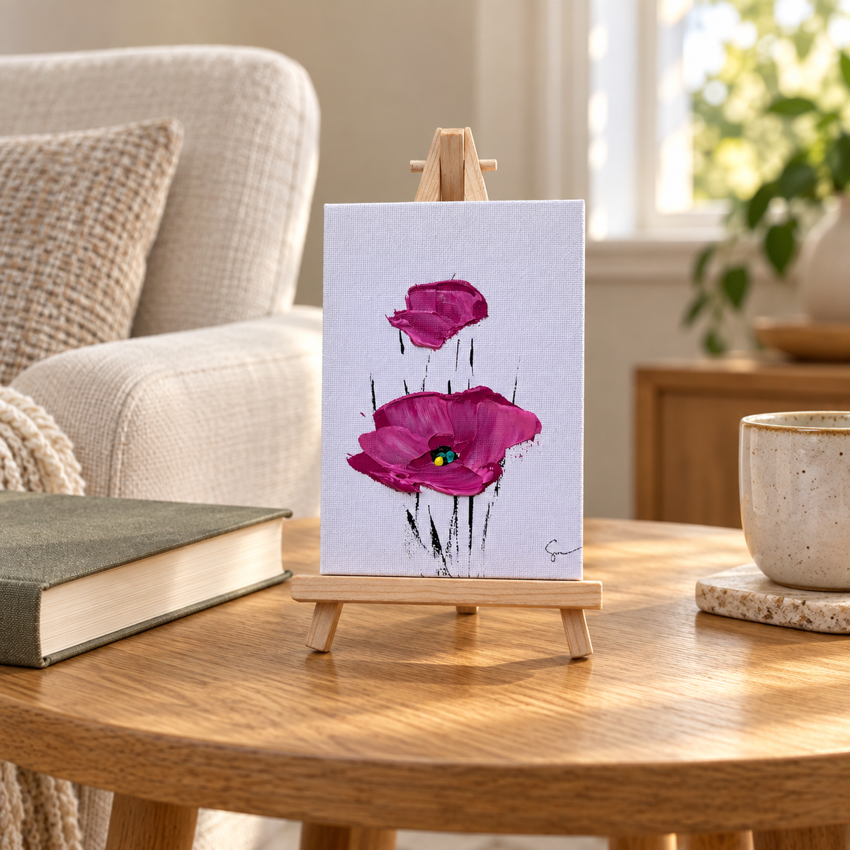 Magenta Sam Glenn 4x6 poppy painting displayed on its wooden easel in a home