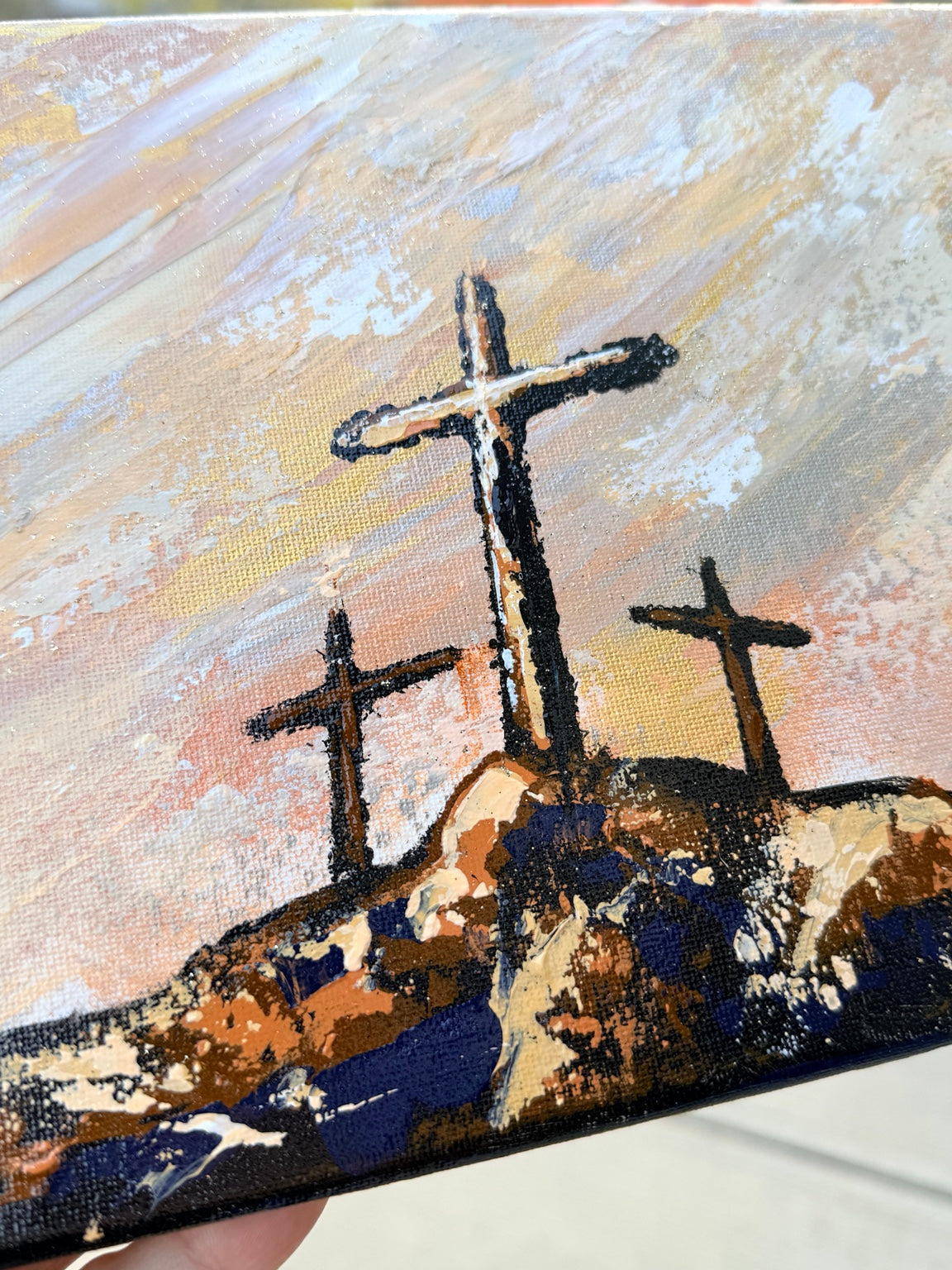 Close-up of three crosses and textured paint